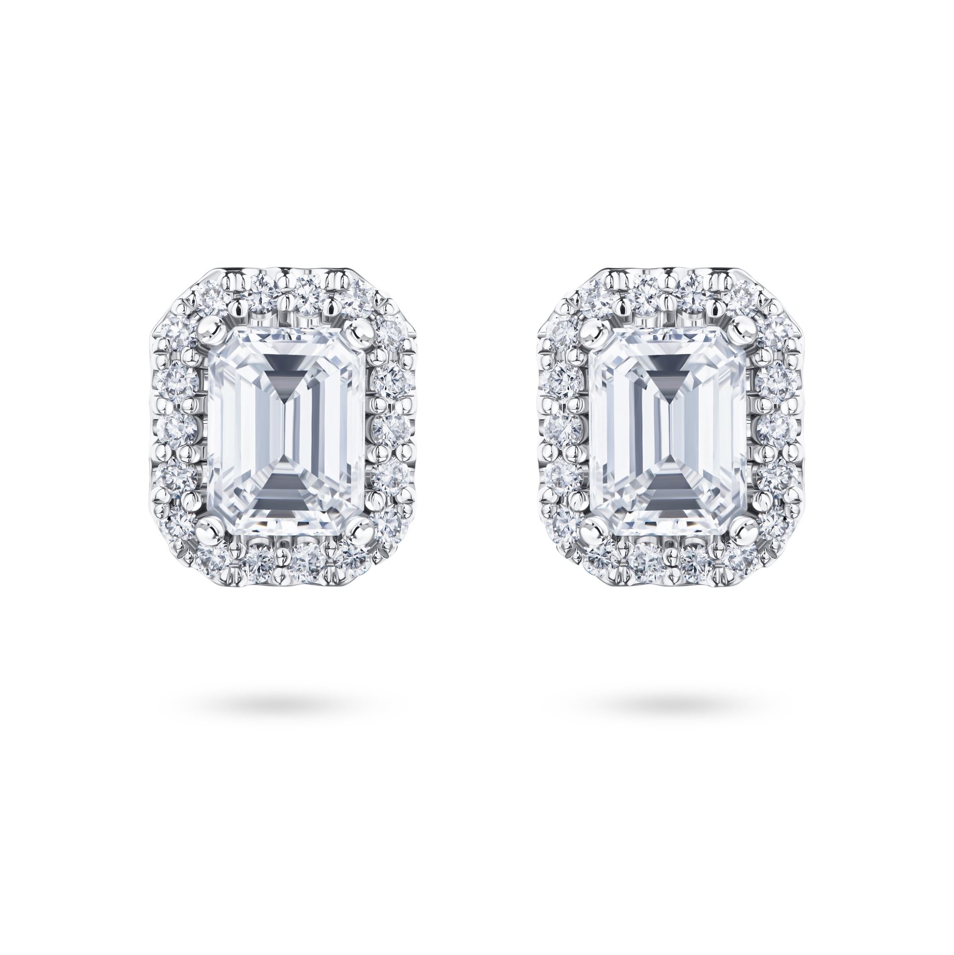 Пусеты из белого золота с бриллиантами 0.51 и 0.59 карата